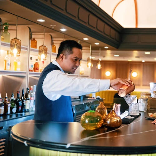 Couple enjoying cocktails in the Atlas Bar