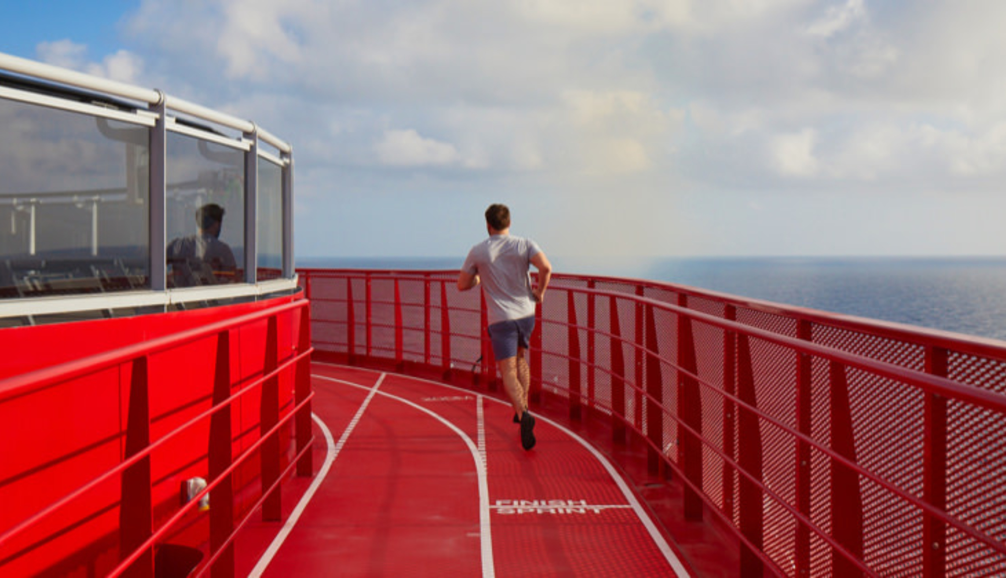 Man running on the running track onboard Virgin Voyages