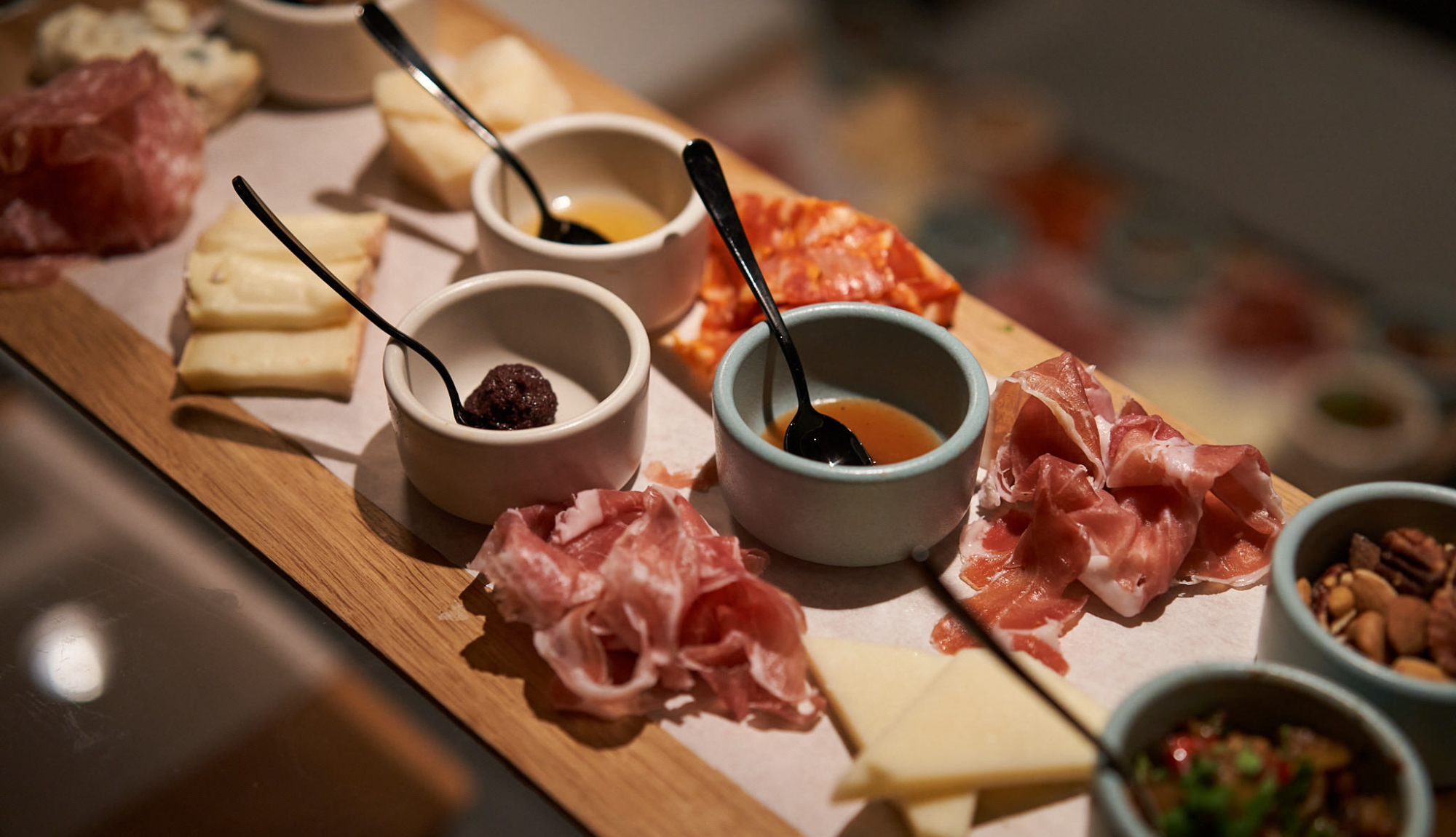 Charcuterie board at Extra Virgin restaurant onboard Virgin Voyages