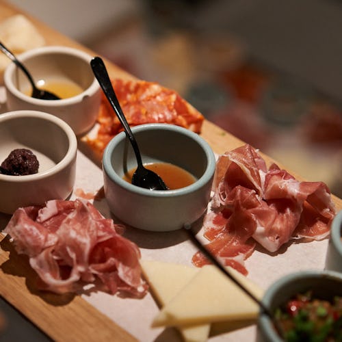 Charcuterie board at Extra Virgin restaurant onboard Virgin Voyages