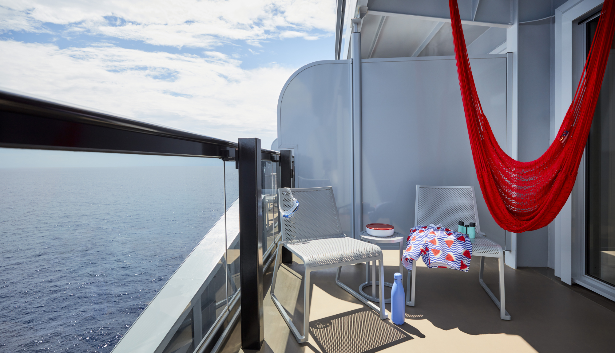 Hammock on the balcony of a sea terrace cabin onboard Virgin Voyages