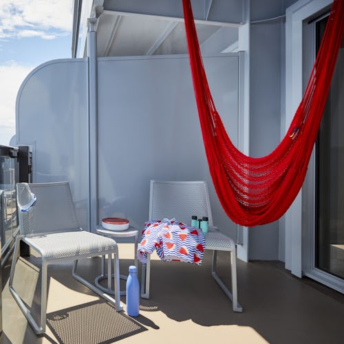 Hammock on the balcony of a sea terrace cabin onboard Virgin Voyages