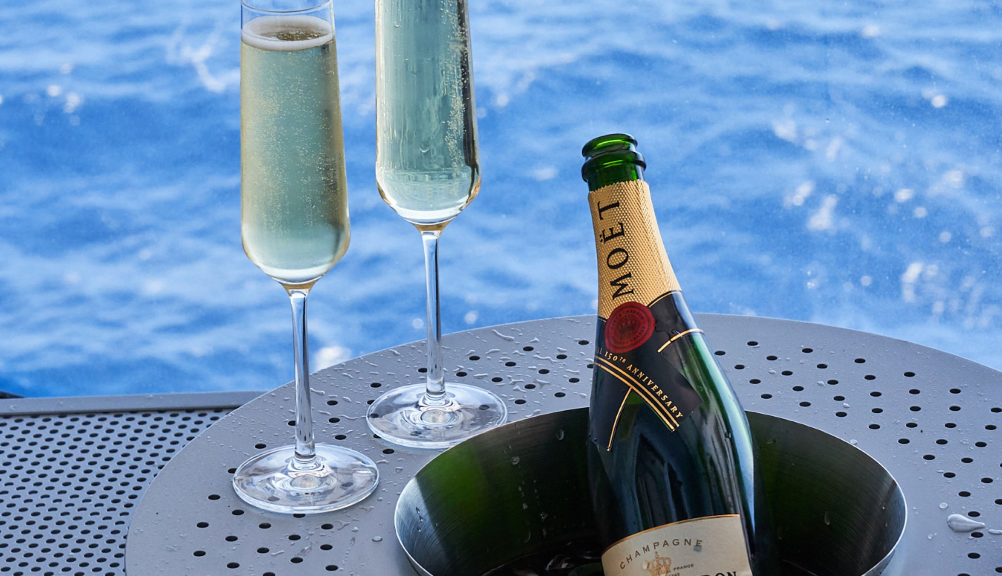 Champagne by the pool after shake for champagne onboard Virgin Voyages