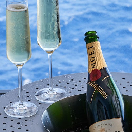 Champagne by the pool after shake for champagne onboard Virgin Voyages
