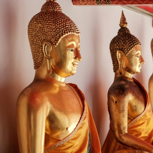 Gold buddha statues at Wat Pho temple in Bangkok, Thailand
