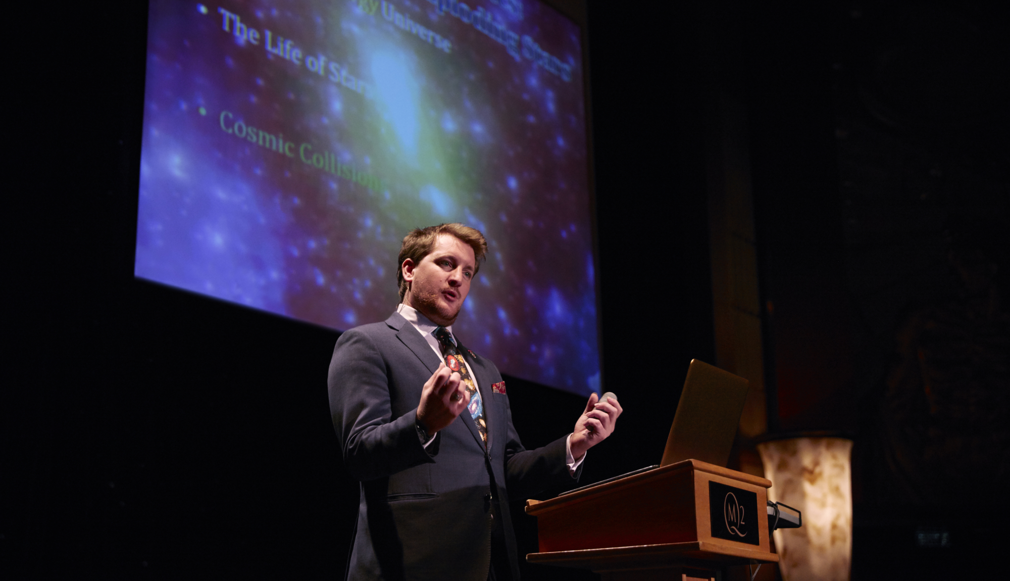 A speaker at Illuminations at the Planetarium onboard Cunard's Queen Mary 2