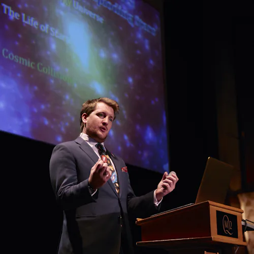 A speaker at Illuminations at the Planetarium onboard Cunard's Queen Mary 2