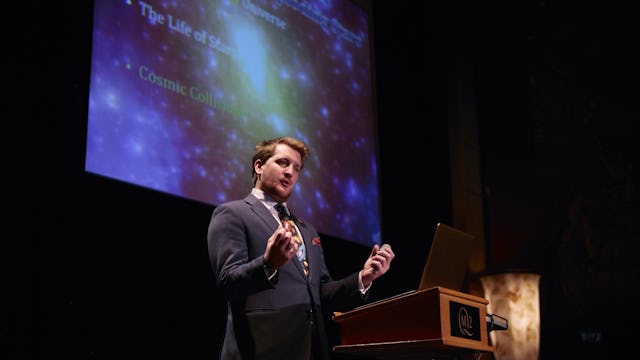 A speaker at Illuminations at the Planetarium onboard Cunard's Queen Mary 2