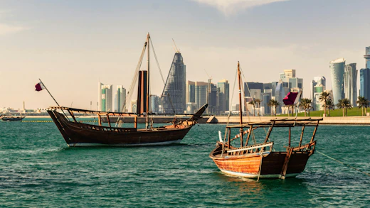 Traditional Qatari boats sailing in the bay of Doha