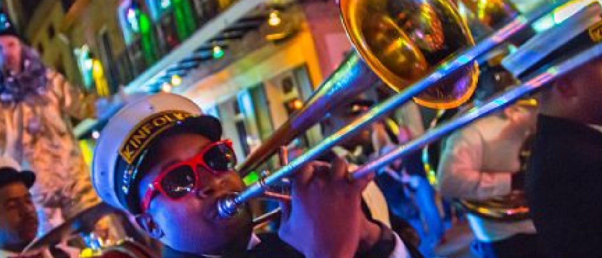 Brass band rolling through New Orleans during Mardi Gras