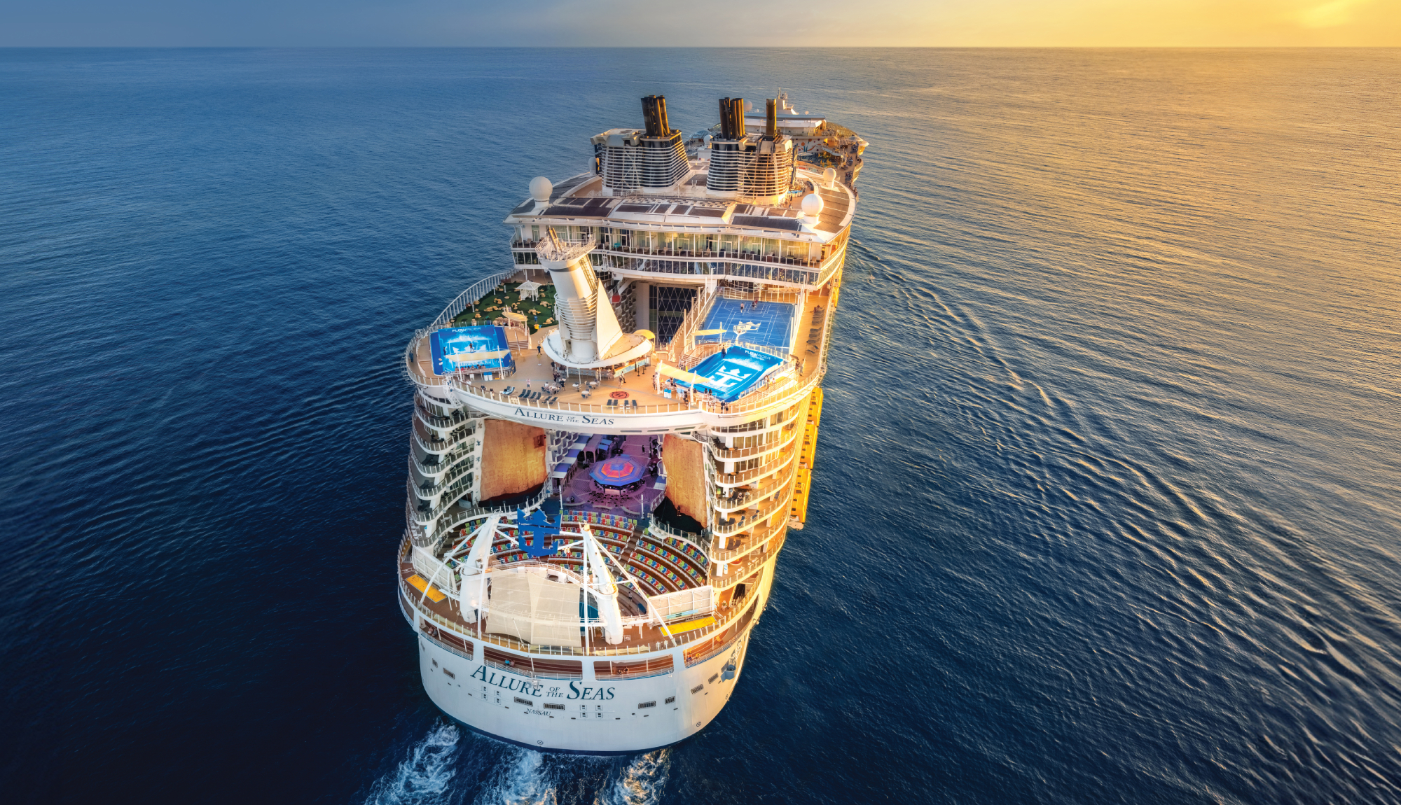 Allure of the Seas sailing into the sunset