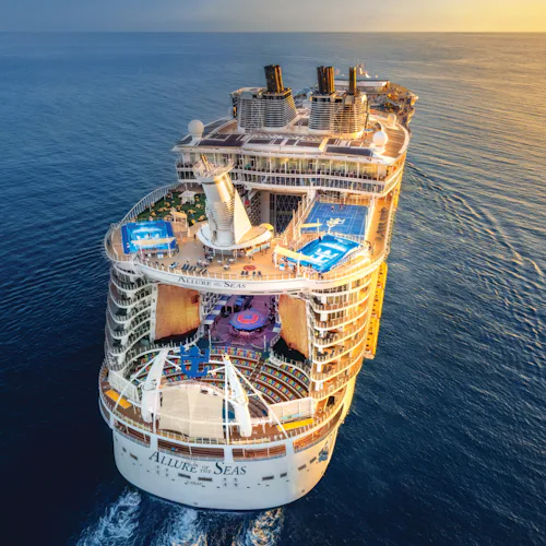 Allure of the Seas sailing into the sunset