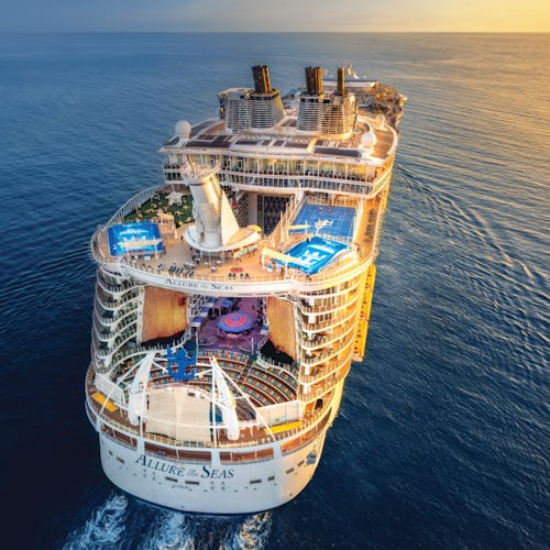 Allure of the Seas sailing into the sunset