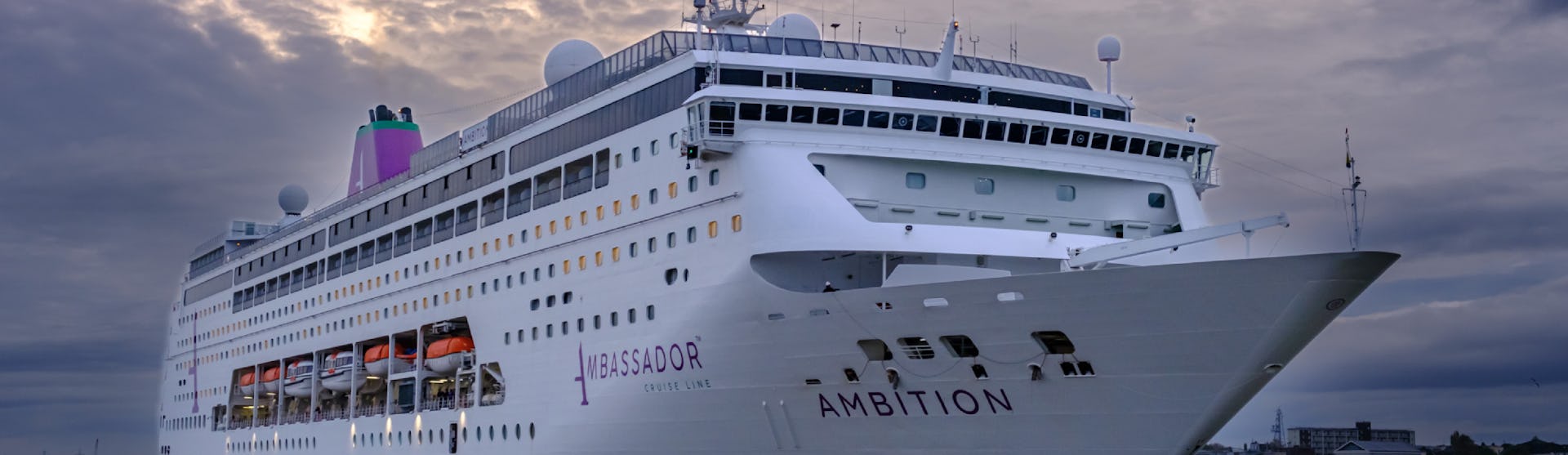 Ambassador Cruise Line's ship Ambition sailing into port
