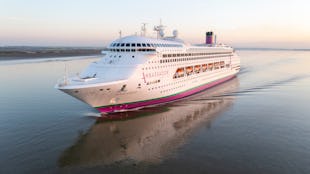 Ambassador Cruise Line's ship Ambience sailing into port