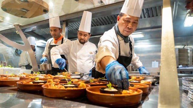 Chefs preparing food onboard Ambassador Cruise Line ship