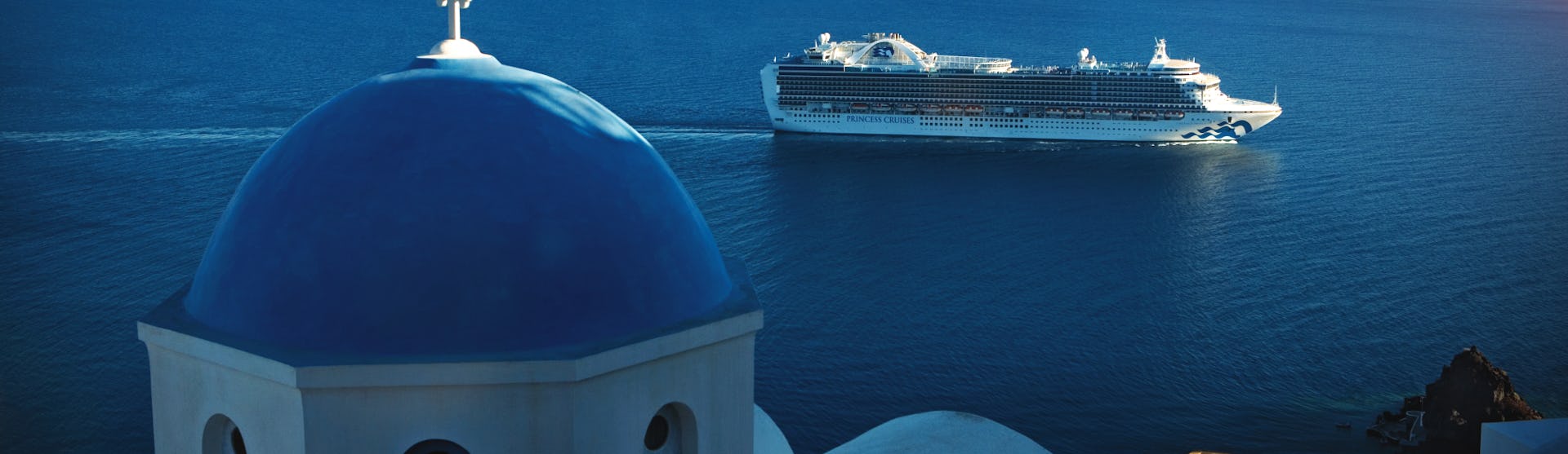 Emerald Princess sailing in Santorini