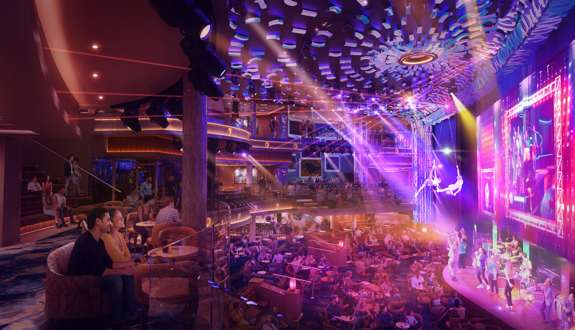 Guests enjoying a show at Centre Stage onboard Carnival Celebration