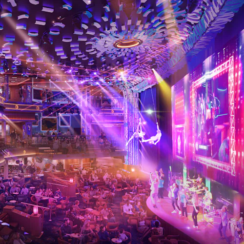 Guests enjoying a show at Centre Stage onboard Carnival Celebration