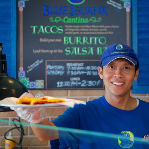 Crew serving food from BlueIguana Cantina