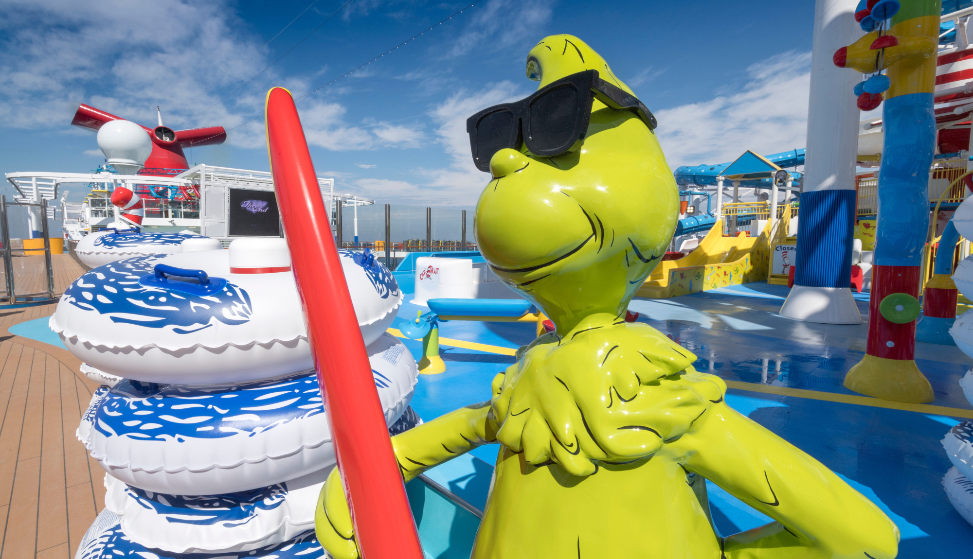 Animated Grinch Character on the pool deck of Carnival Horizon