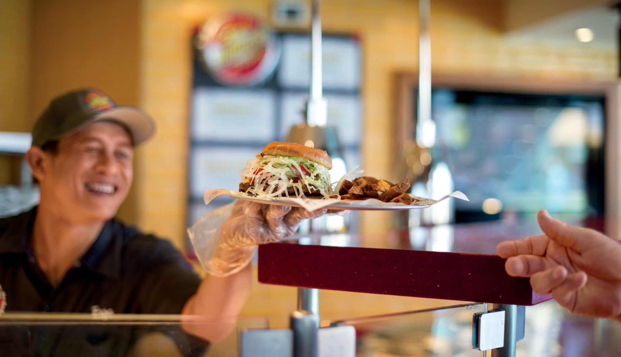 Crew serving food at Guys Burger Joint