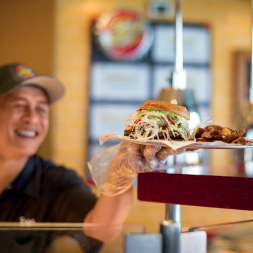 Crew serving food at Guys Burger Joint