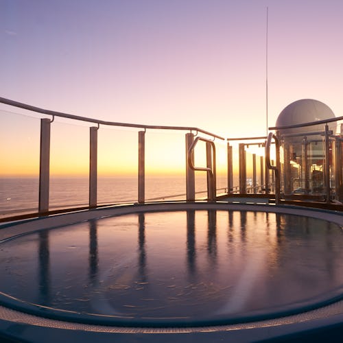 View of a jacuzzi in Serenity at sunset