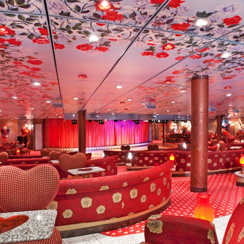 The Mad Hatters Ball lounge onboard Carnival Miracle