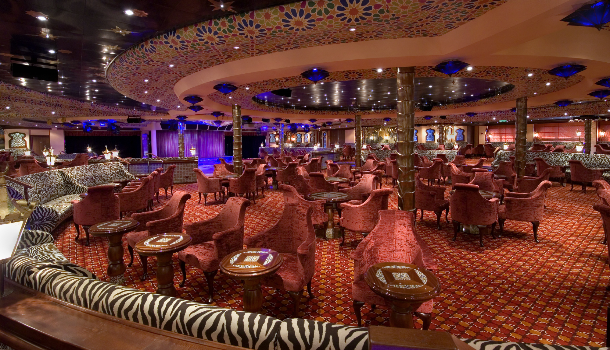 Decor and seating of El Morocco Lounge at the aft of Carnival Splendor