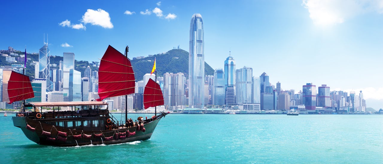A boat sailing on the harbour in Hong Kong