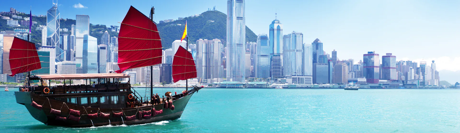 A boat sailing on the harbour in Hong Kong