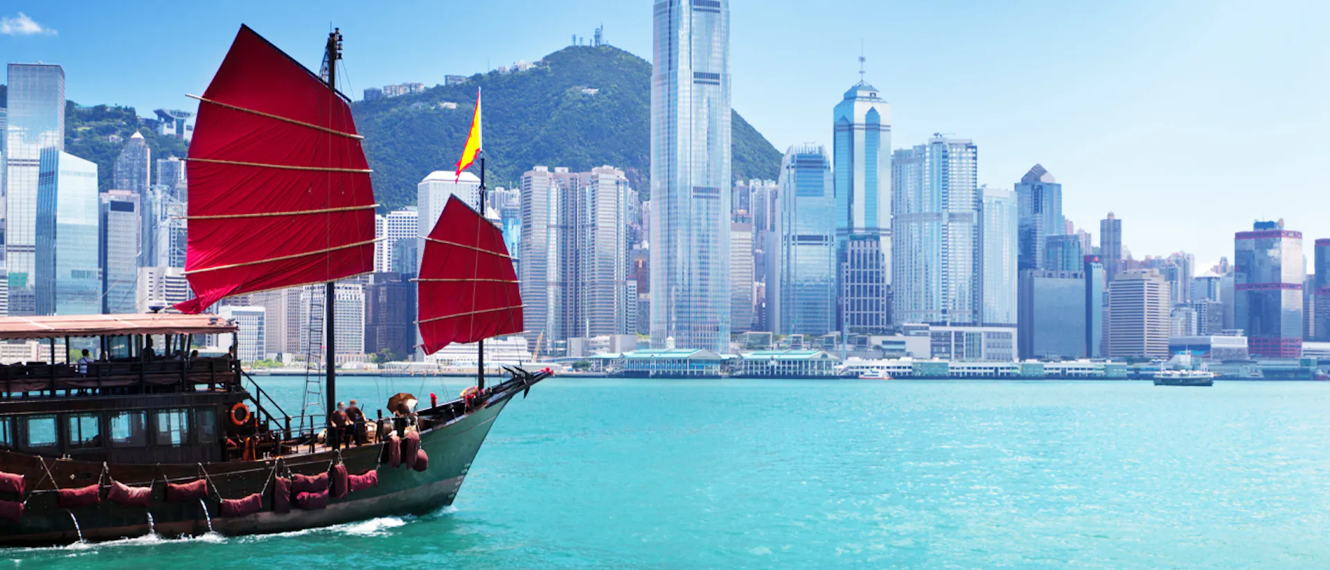 A boat sailing on the harbour in Hong Kong