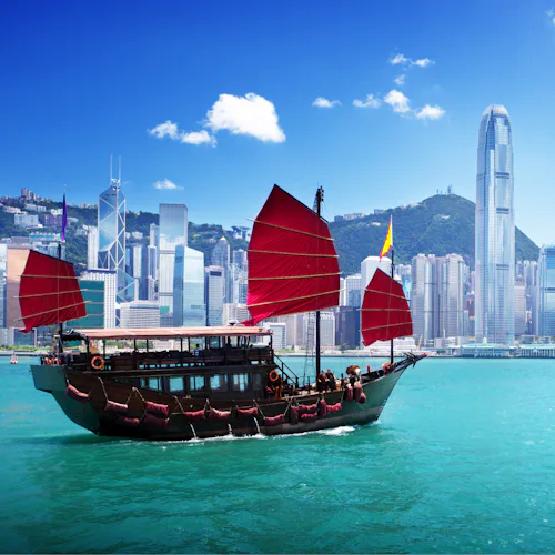 A boat sailing on the harbour in Hong Kong