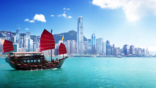 A boat sailing on the harbour in Hong Kong