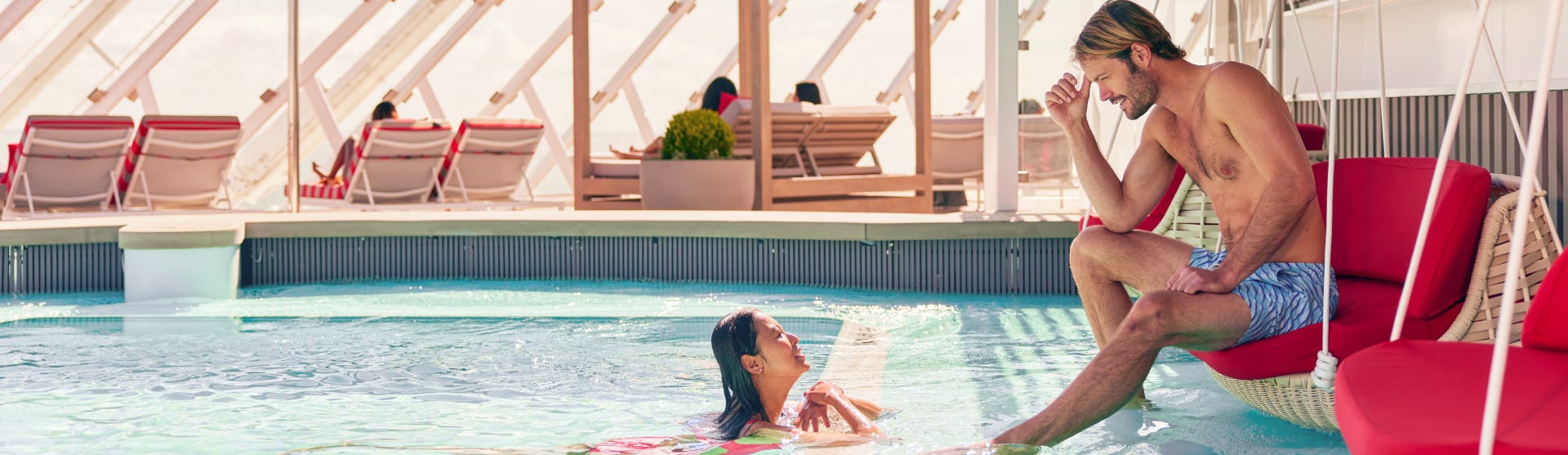A couple enjoying the private sundeck on Celebrity Cruises The Retreat