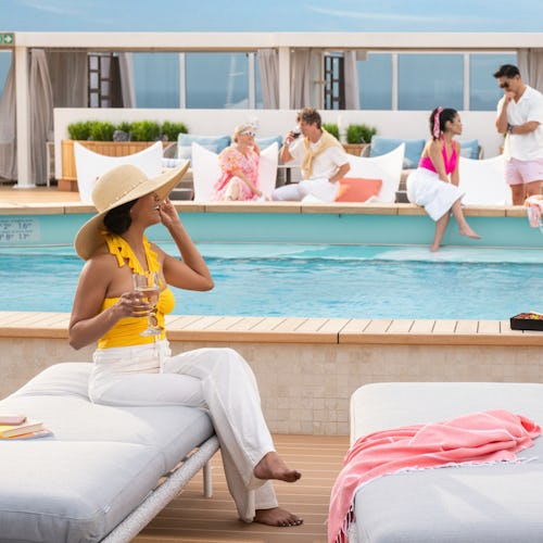 Guests relaxing by the pool on Princess Cruises