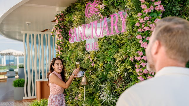A couple enjoying champagne in the Sanctuary onboard Princess