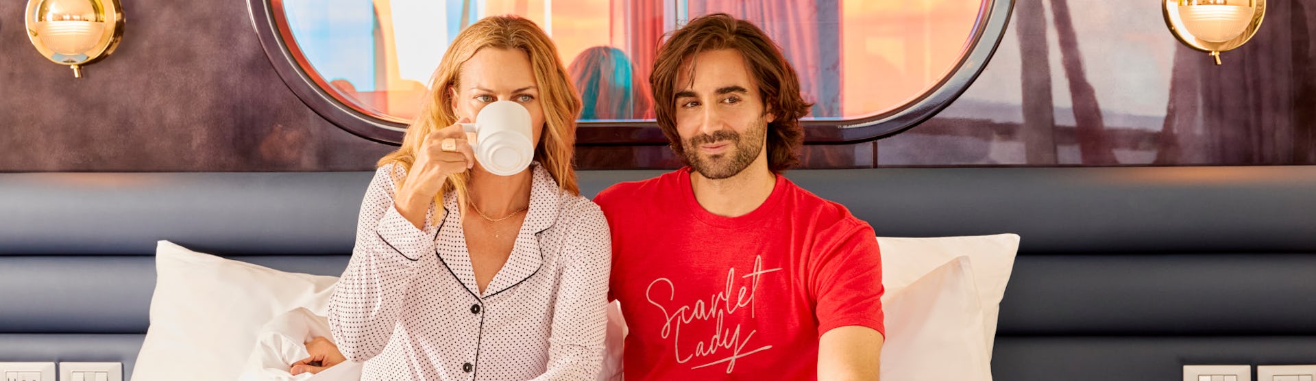 A couple enjoying breakfast in their suite onboard Virgin Voyages