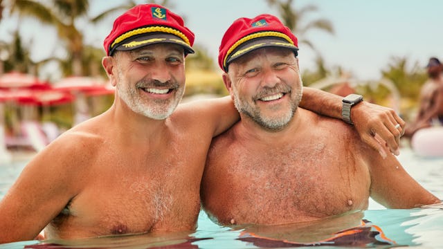 Two men enjoying the pool at Virgin Voyages private island destination The Beach Club at Bimini