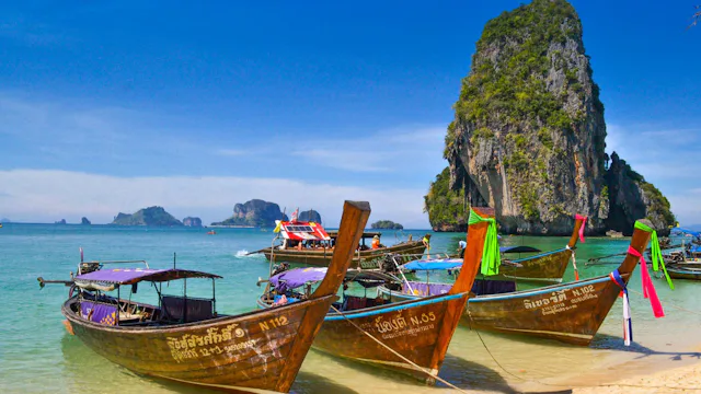 Traditional longtail boats on a beach in Phuket, Thailand