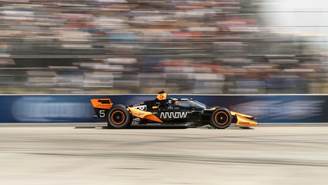 F1 car racing with Paramount Cruises customers watching on