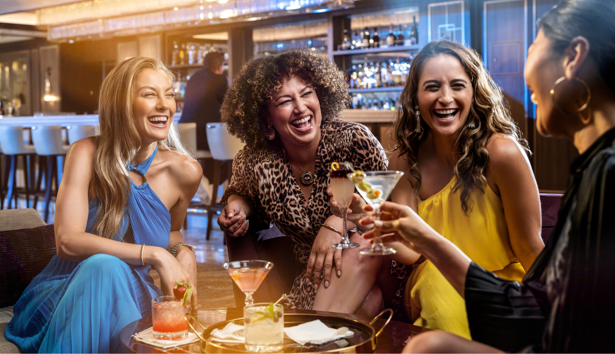 Group of women enjoying cocktails included in the Princess Plus and Premier Packages