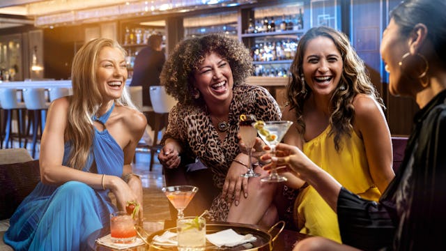 Group of women enjoying cocktails included in the Princess Plus and Premier Packages