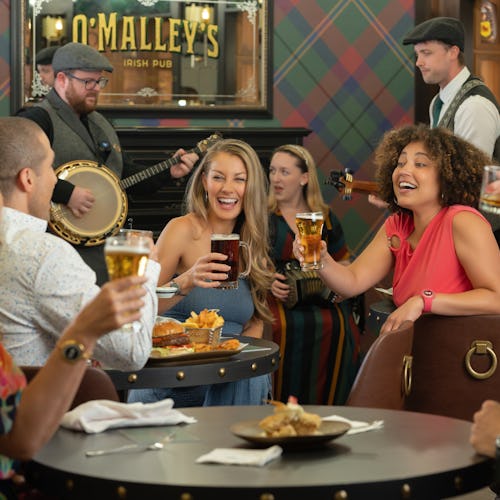 Guests enjoying drinks in the pub included with their Princess Plus and Premier Packages