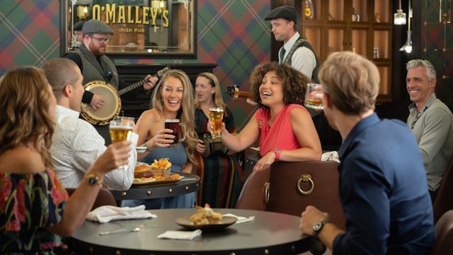 Guests enjoying drinks in the pub included with their Princess Plus and Premier Packages