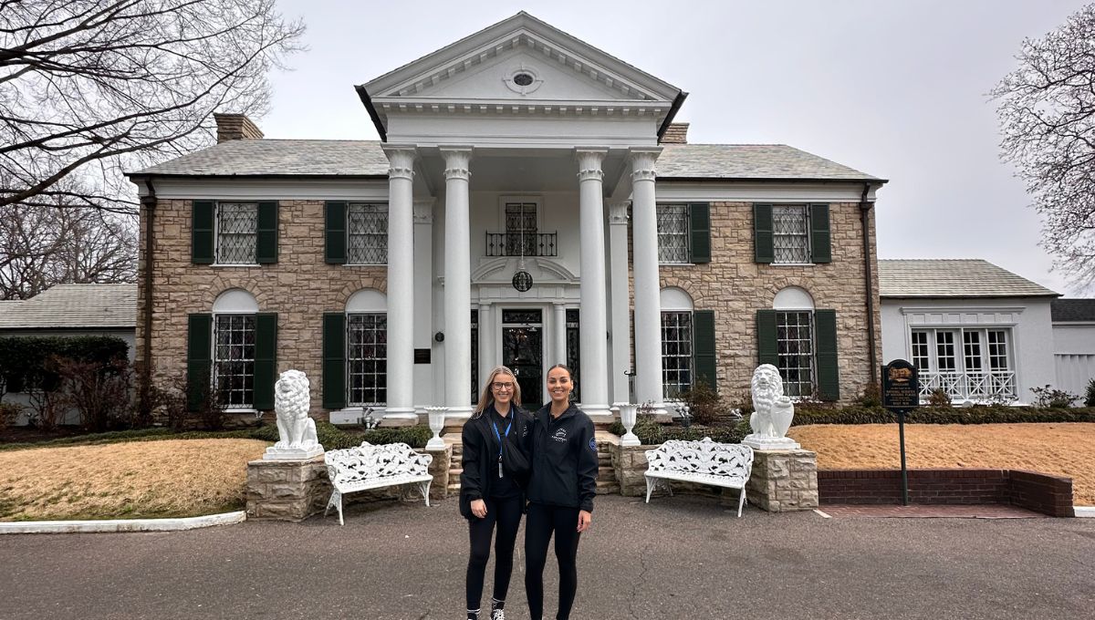 Leah and Jess from Paramount Cruises outside of Elvis Presley's Graceland mansion