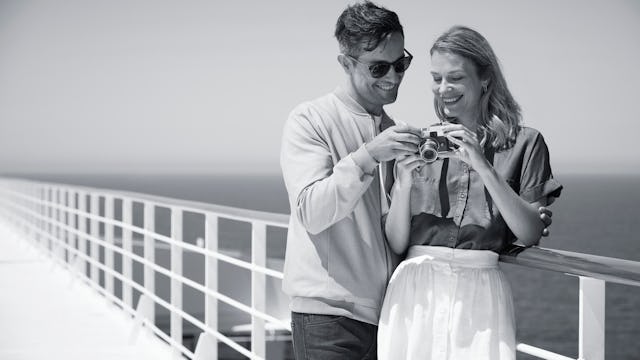 A couple on deck of Cunard's Queen Mary 2