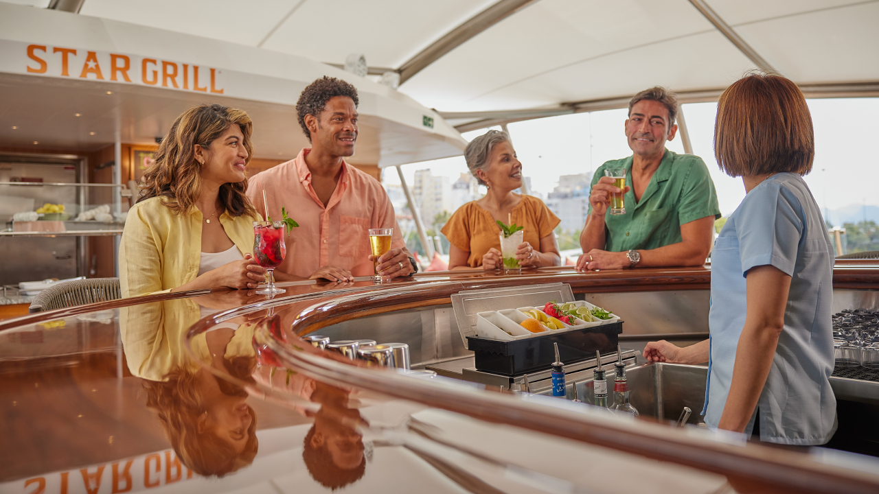 Guests enjoying cocktails onboard Windstar Cruises
