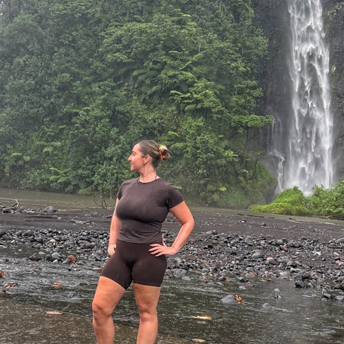 Caitlin in Tahiti by the waterfall